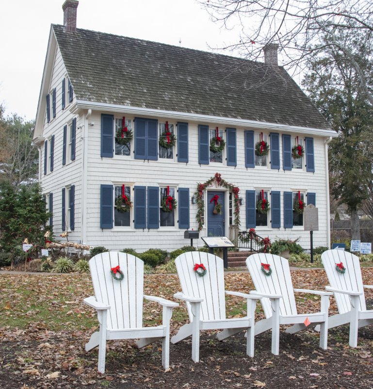 The Hiram Rodney Burton House is decked out with greens and ribbons at the Shipcarpenter Street campus.